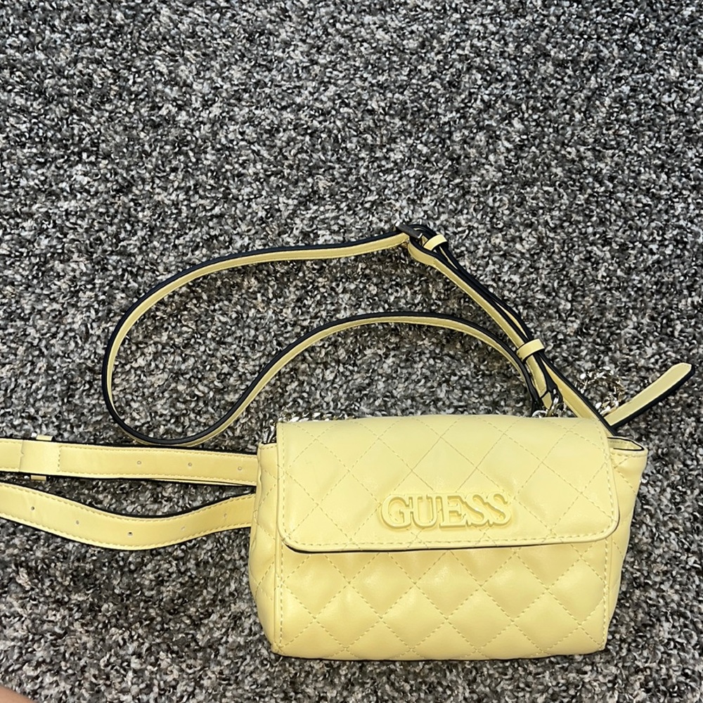 Yellow Guess purse/fanny pack with removable and adjustable straps.